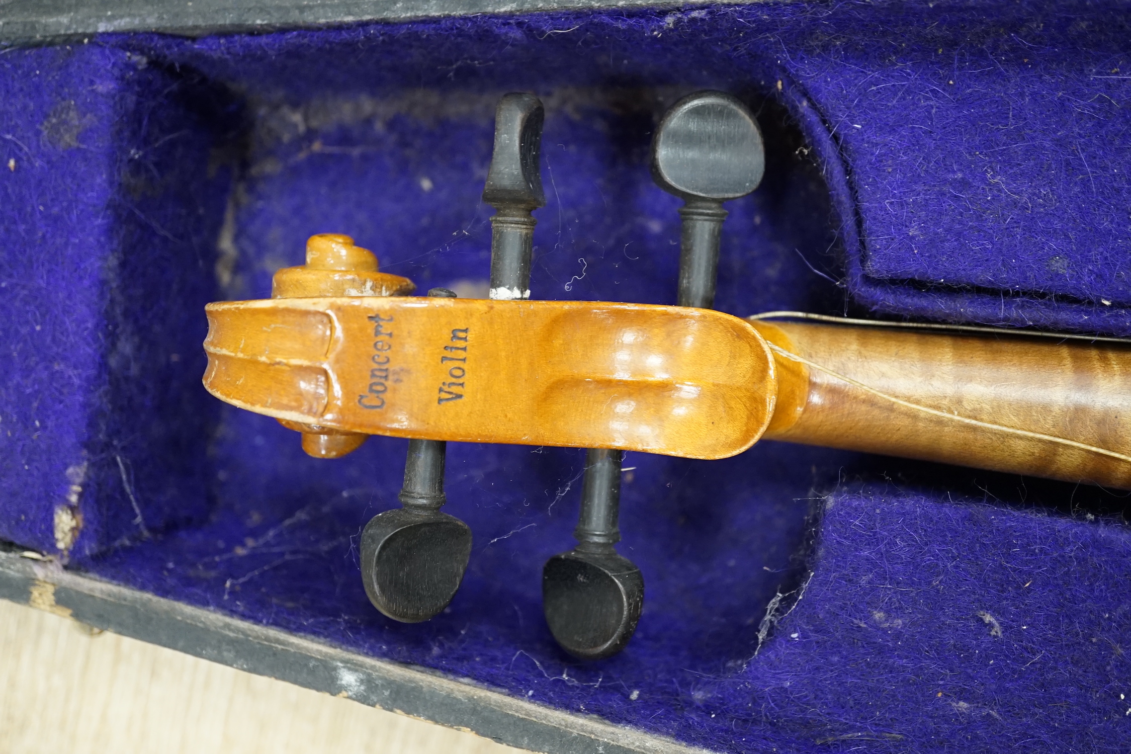 A wooden cased early 20th century Czechoslovakian student’s violin, bears ‘Copy of Stradivarius’ label, body length, 35.5cm, without bow